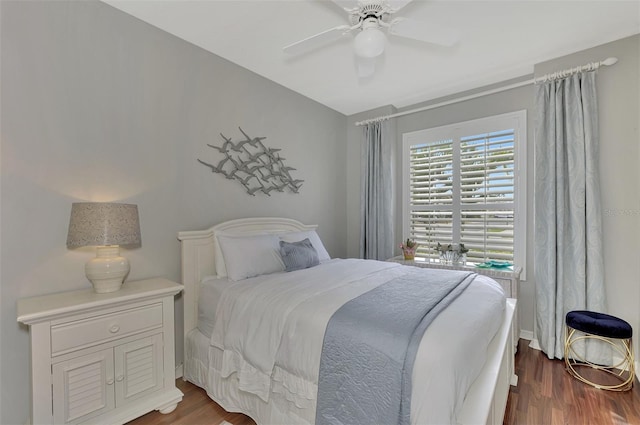 bedroom featuring ceiling fan and dark hardwood / wood-style floors