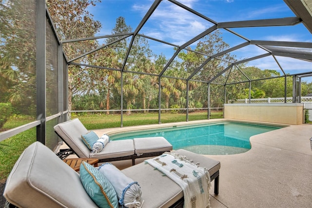 view of pool featuring a lanai and a patio