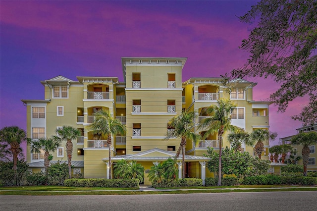 view of outdoor building at dusk