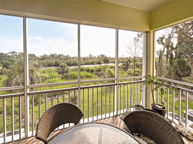 sunroom with a water view