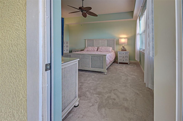 bedroom with light carpet and ceiling fan