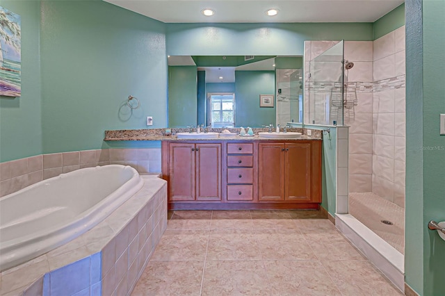 bathroom featuring separate shower and tub, vanity, and tile patterned floors