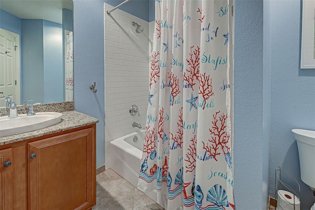 full bathroom featuring toilet, tile patterned floors, shower / bath combo, and vanity