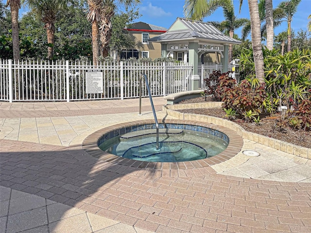 view of swimming pool with a community hot tub