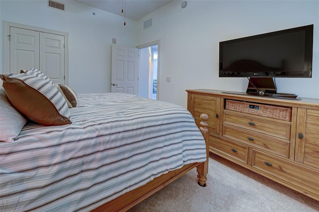 carpeted bedroom with a closet