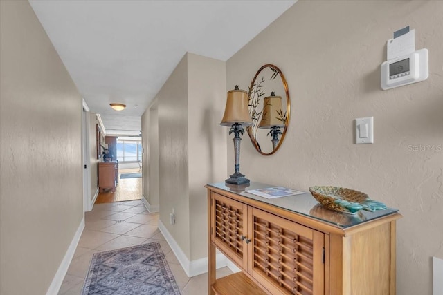 hallway with light tile patterned flooring