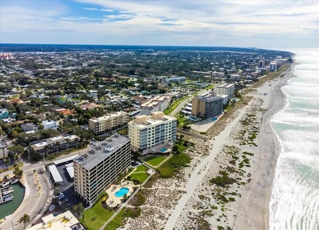 bird's eye view with a beach view and a water view