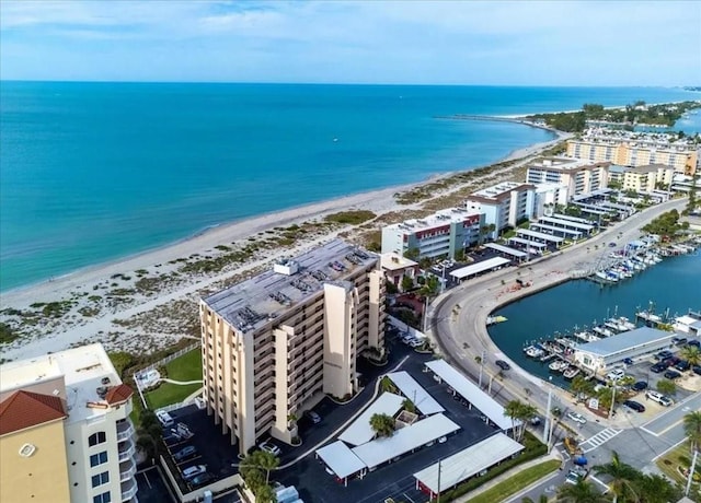 birds eye view of property featuring a water view and a view of the beach