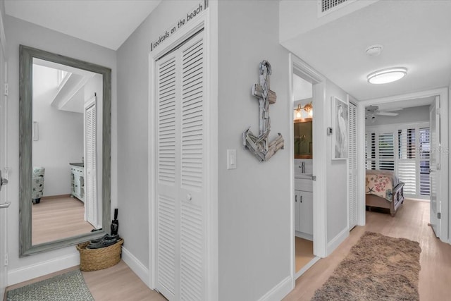 corridor featuring light hardwood / wood-style flooring