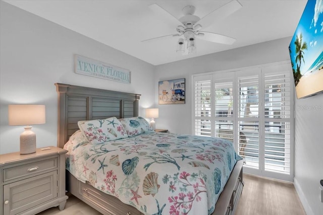 bedroom with light hardwood / wood-style flooring and ceiling fan