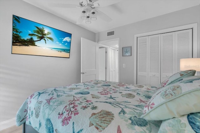 bedroom featuring ceiling fan and a closet