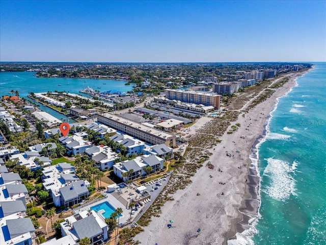 bird's eye view with a water view and a view of the beach