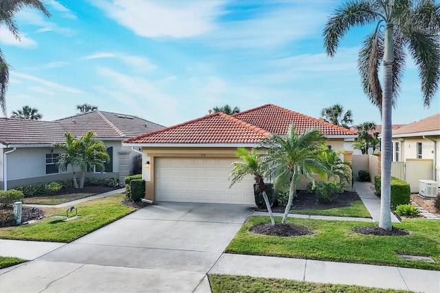 view of front of property with a garage and a front yard