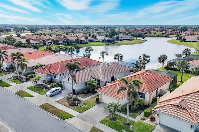 drone / aerial view with a water view