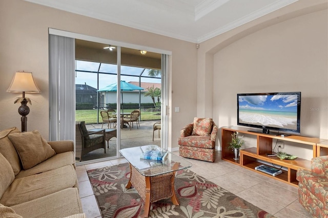 living room with ornamental molding and light tile patterned floors