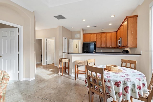 dining area featuring light tile patterned floors