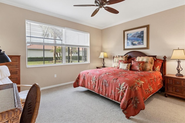 carpeted bedroom featuring crown molding and ceiling fan