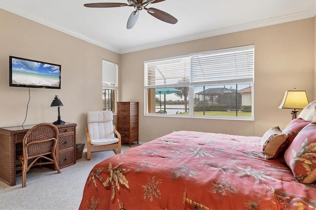 bedroom featuring crown molding, ceiling fan, and carpet flooring