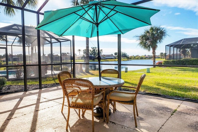 sunroom / solarium featuring a healthy amount of sunlight and a water view