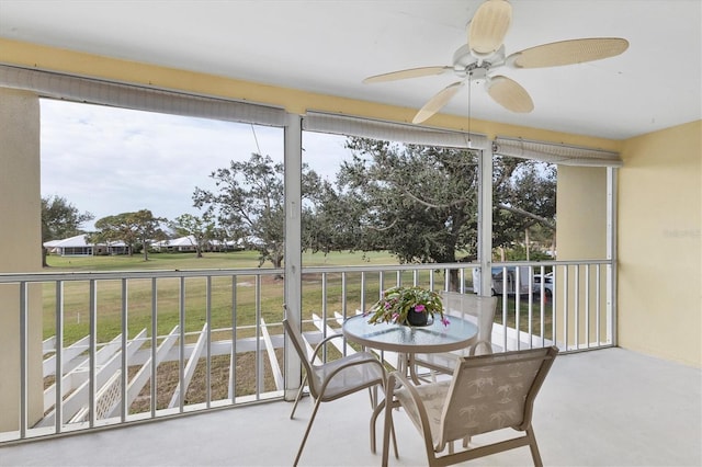 sunroom / solarium with ceiling fan