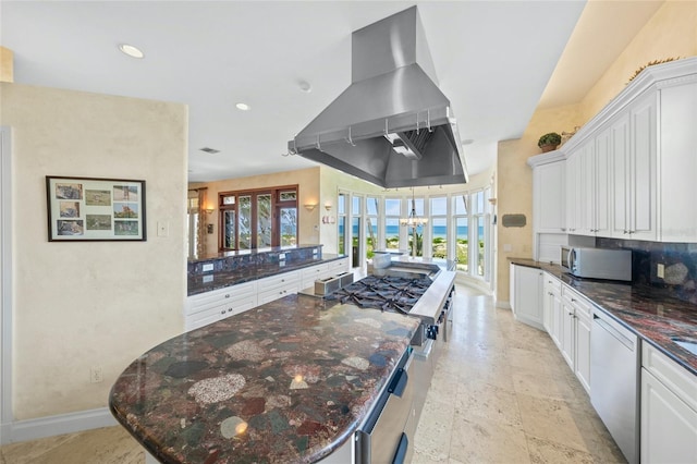 kitchen featuring french doors, a large island, white cabinets, island range hood, and stainless steel appliances