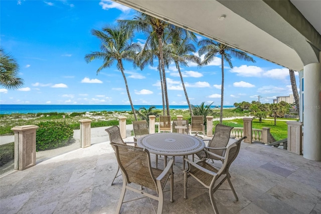 view of patio with a water view