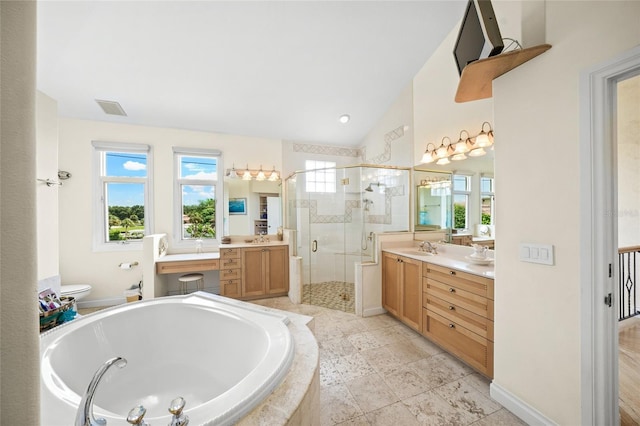 bathroom featuring independent shower and bath, lofted ceiling, and vanity