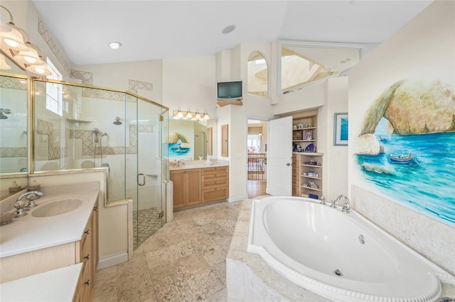 bathroom featuring independent shower and bath, lofted ceiling, and vanity