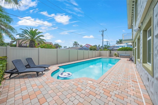 view of swimming pool with a patio