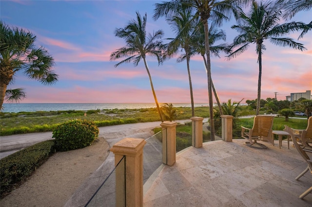 patio terrace at dusk with a water view