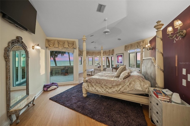 bedroom with ceiling fan and light hardwood / wood-style flooring