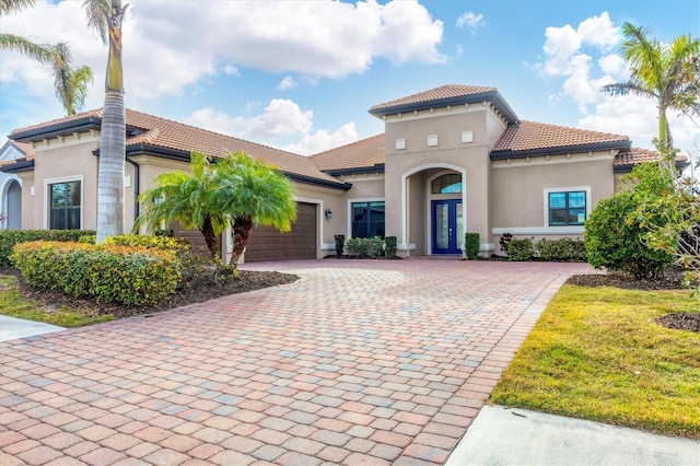 mediterranean / spanish house featuring a garage