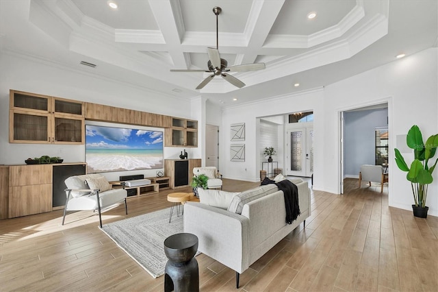 living room with ceiling fan, crown molding, beam ceiling, and coffered ceiling