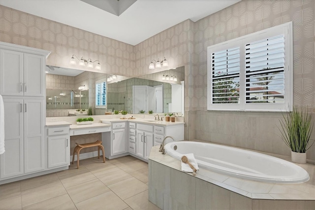 bathroom featuring a stall shower, a garden tub, vanity, and wallpapered walls