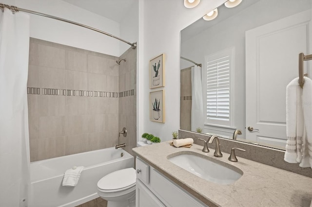 full bath featuring shower / bathtub combination with curtain, toilet, and vanity