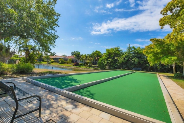 surrounding community featuring a water view