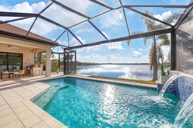 view of pool featuring glass enclosure, area for grilling, a patio area, a water view, and pool water feature