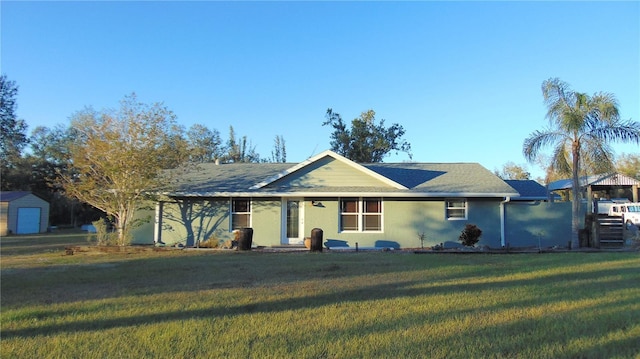 ranch-style house with a front lawn