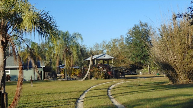 view of home's community featuring a gazebo and a yard