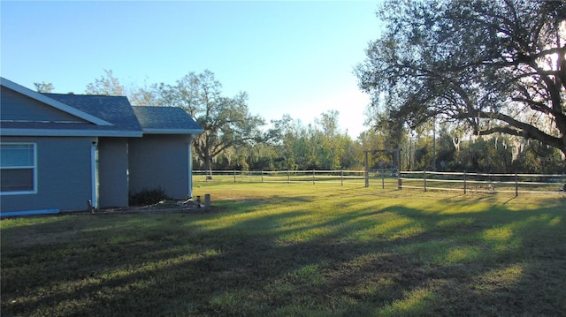 view of yard with a rural view