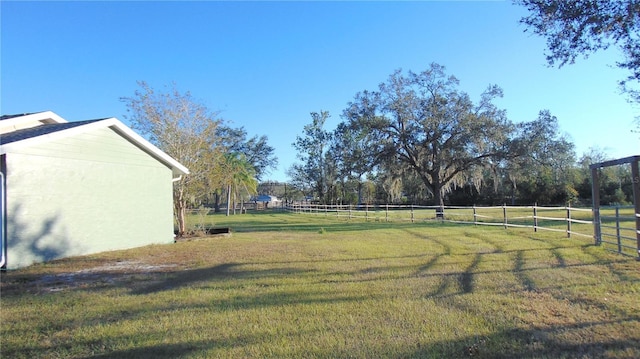 view of yard with a rural view