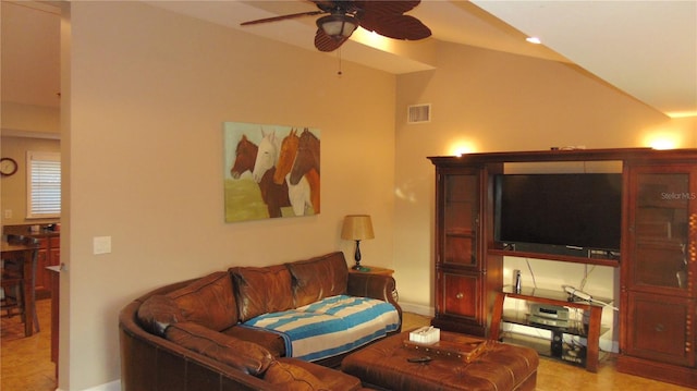 living room featuring ceiling fan and vaulted ceiling