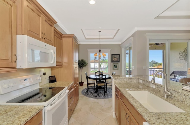 kitchen featuring white appliances, hanging light fixtures, a chandelier, crown molding, and sink