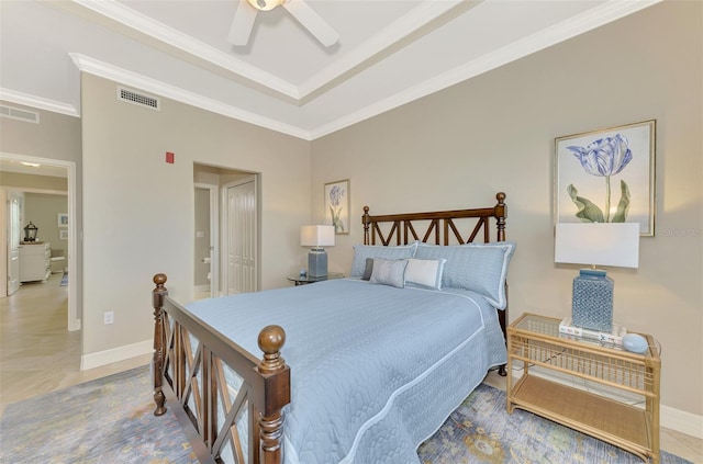 bedroom featuring ceiling fan, a tray ceiling, and crown molding