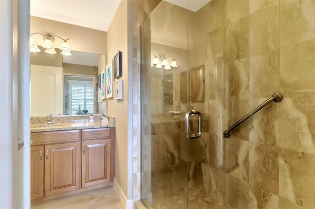 bathroom featuring vanity, tile patterned flooring, and walk in shower