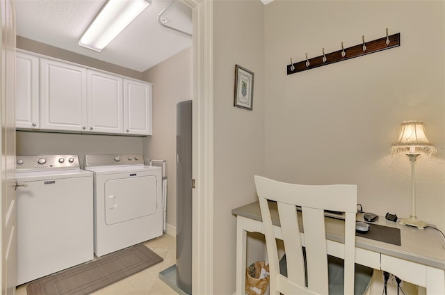 washroom featuring cabinets, a textured ceiling, light tile patterned floors, and washing machine and dryer