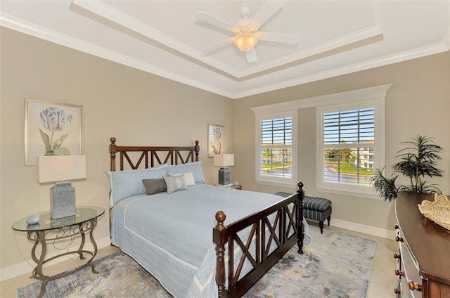 bedroom with ceiling fan, crown molding, a raised ceiling, and light tile patterned flooring