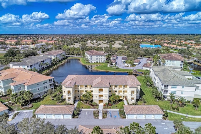 bird's eye view featuring a water view and a residential view