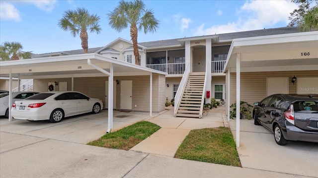 townhome / multi-family property with a carport