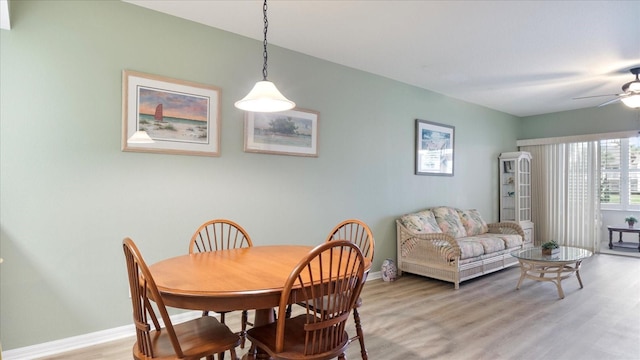 dining room featuring light hardwood / wood-style floors and ceiling fan